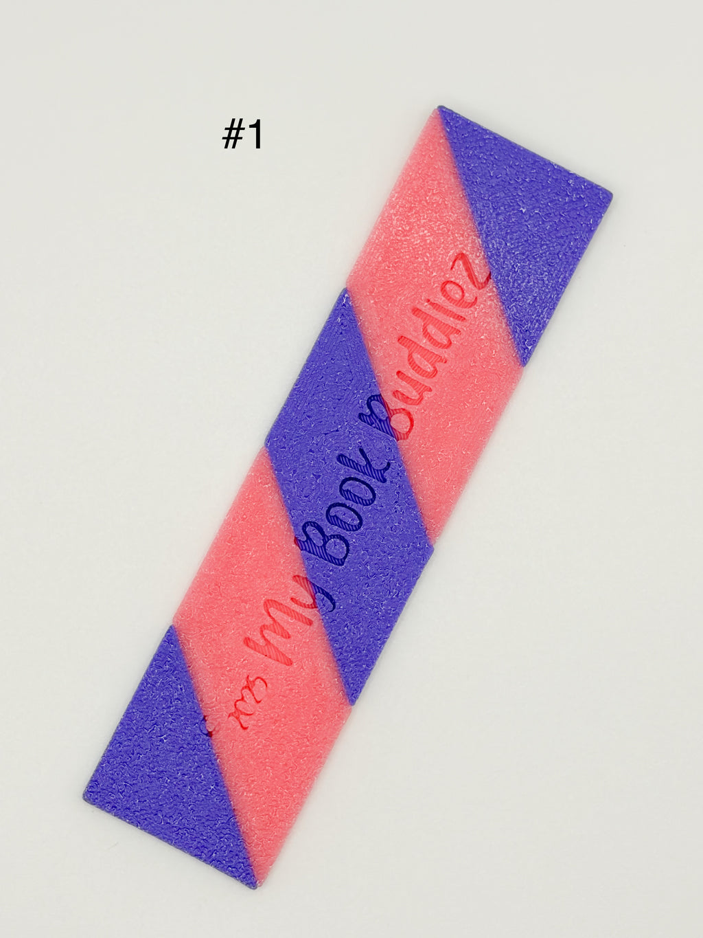 Interchangeable striped bookmarks for articulated bookmark toppers