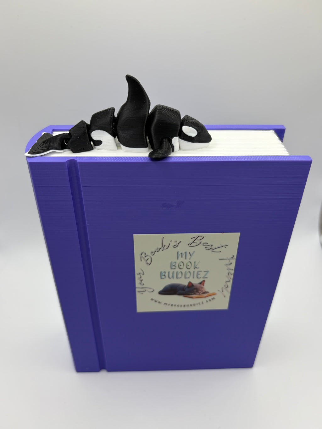 Close-up of Nova the Orca bookmark buddy showing articulated joints