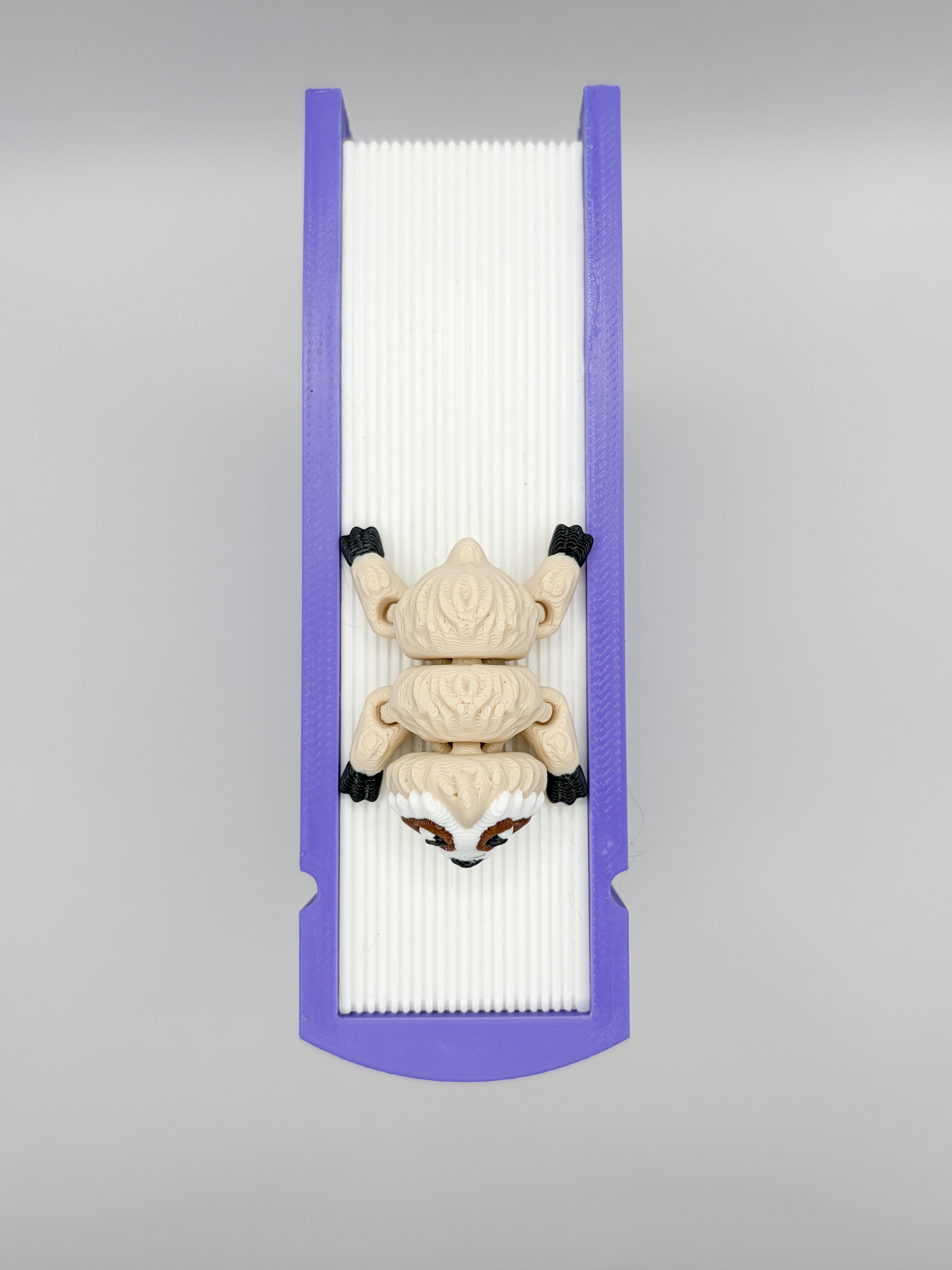 Close-up of Sid the Sloth bookmark buddy showing articulated limbs