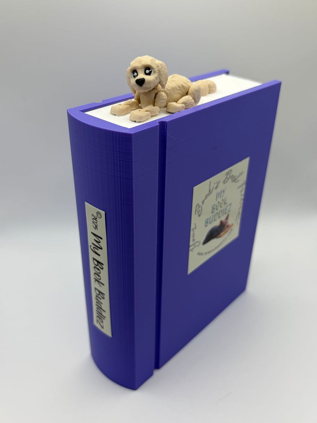 Daisy the Dog articulated bookmark topper with movable arms, legs, and tail